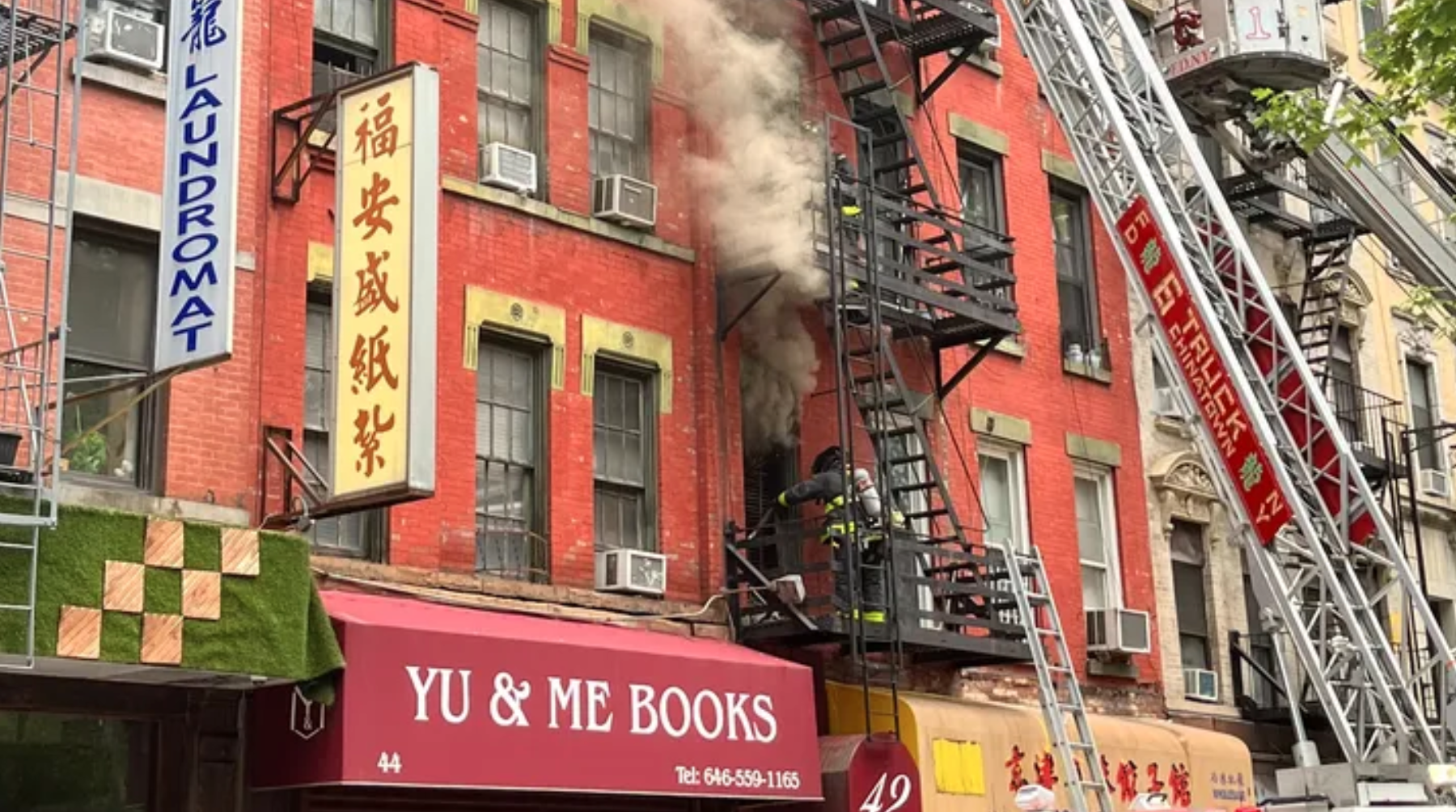 After fire, community rallies to save Yu & Me Books in NYC's